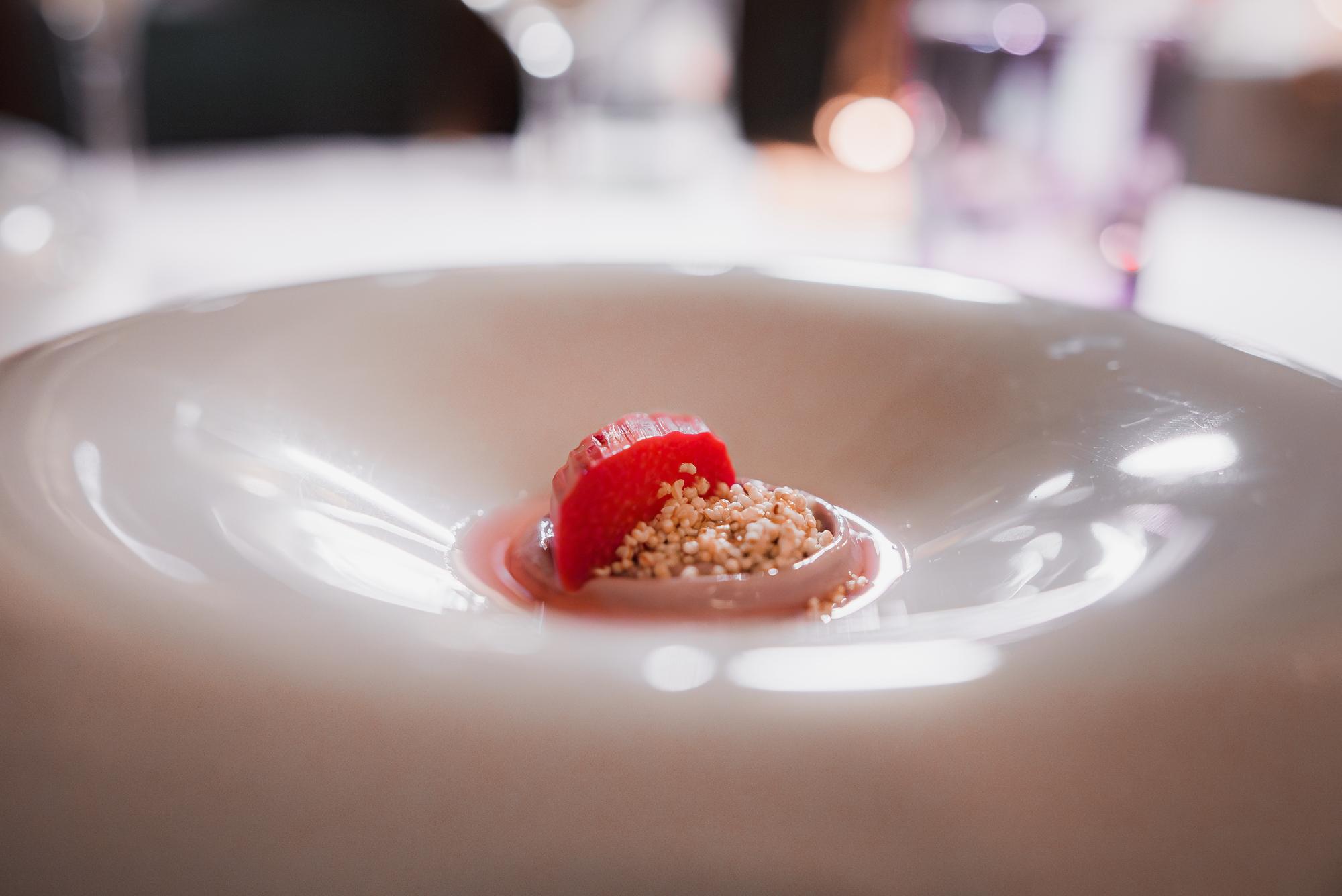 Close-up of plated degustation course with muted tones